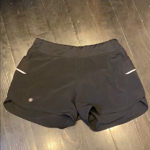 Shorts with reflective strips and pockets